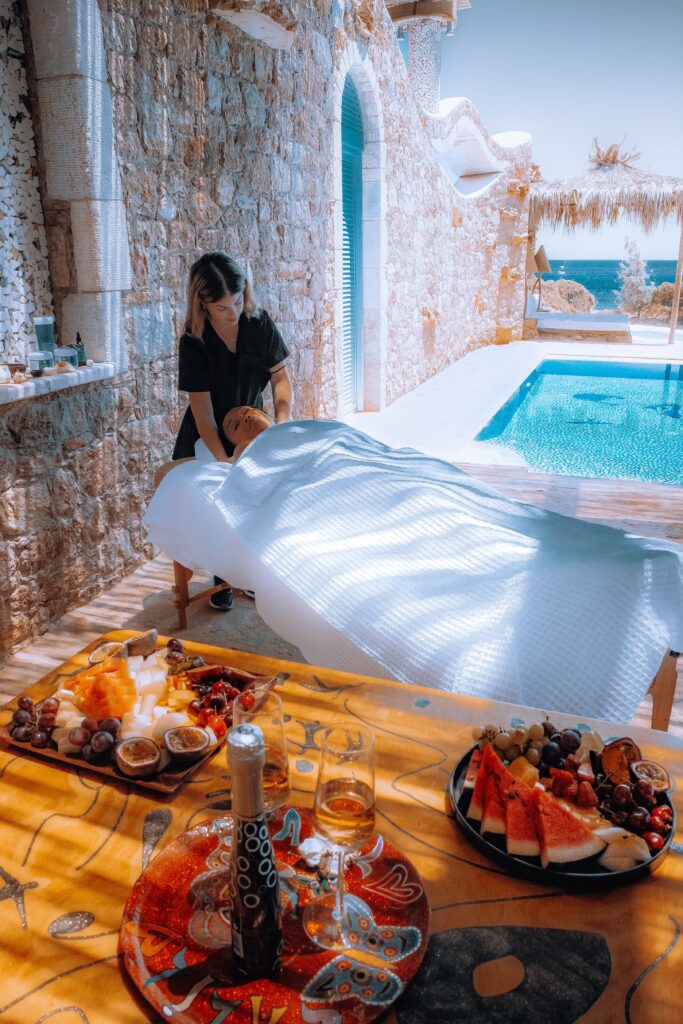 Masseuse gives a massage in a suite at the Calilo Resort in Ios, Greece