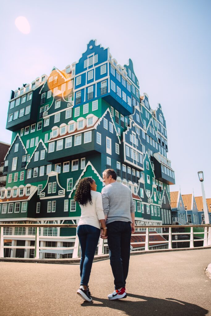 Couple walks along the street in Zandaam in Amsterdam