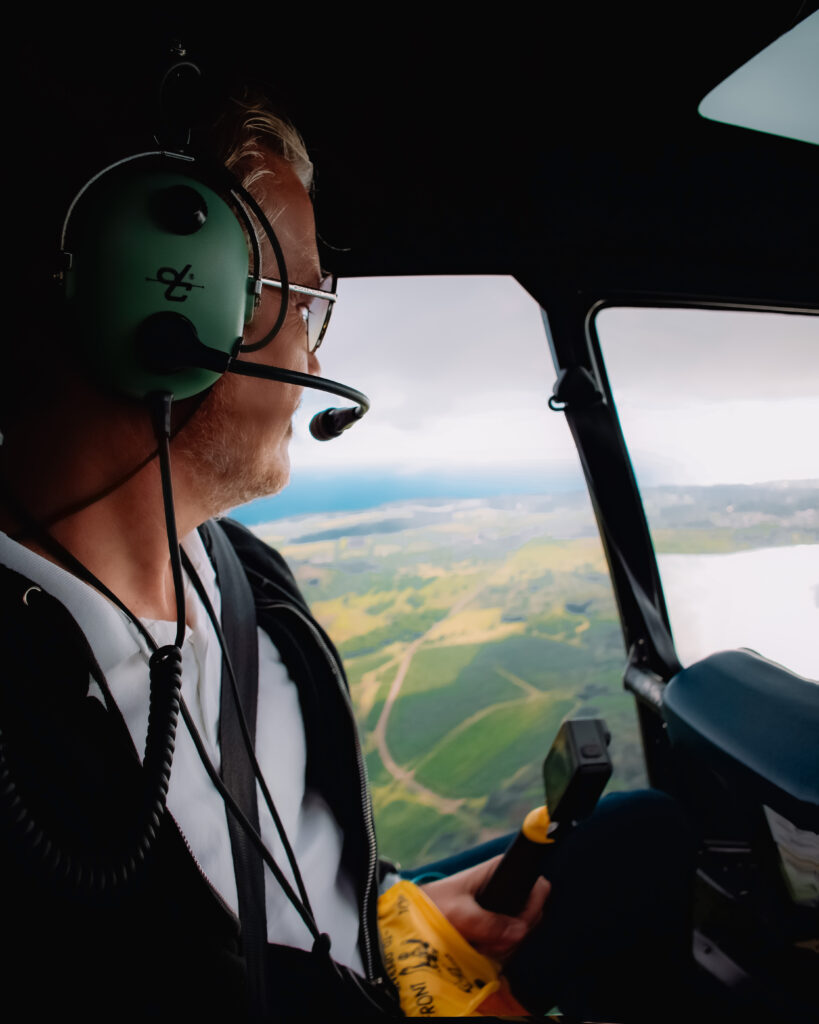 Brett looks out from the helicopter as he and Zee enjoys a private tour around Kauai