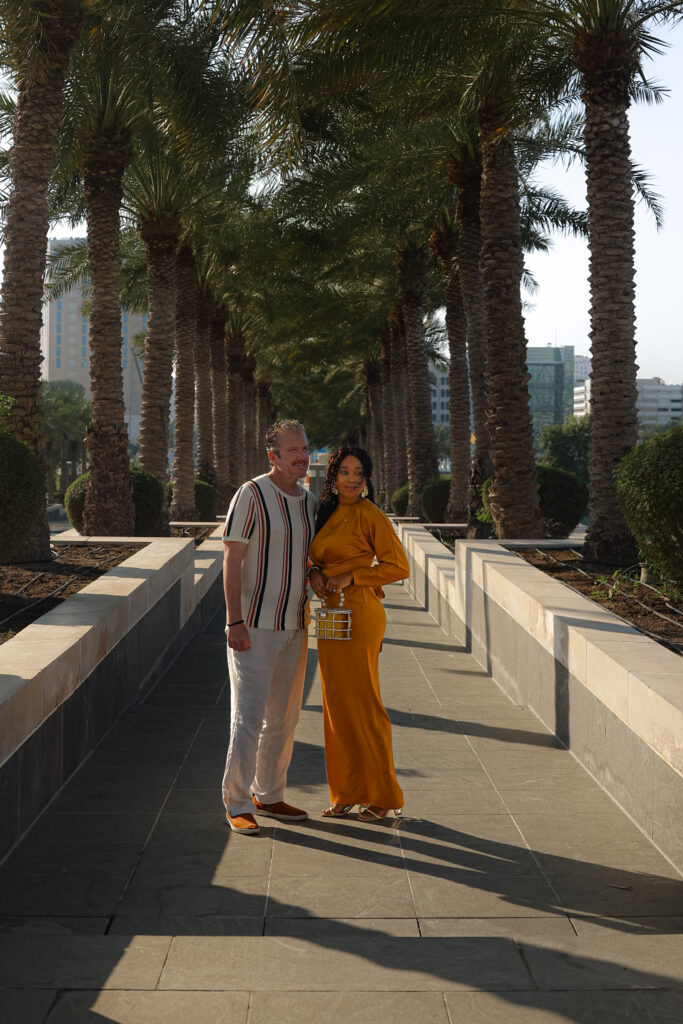 Brett and Zee stands outside the Museum Of Islamic Art