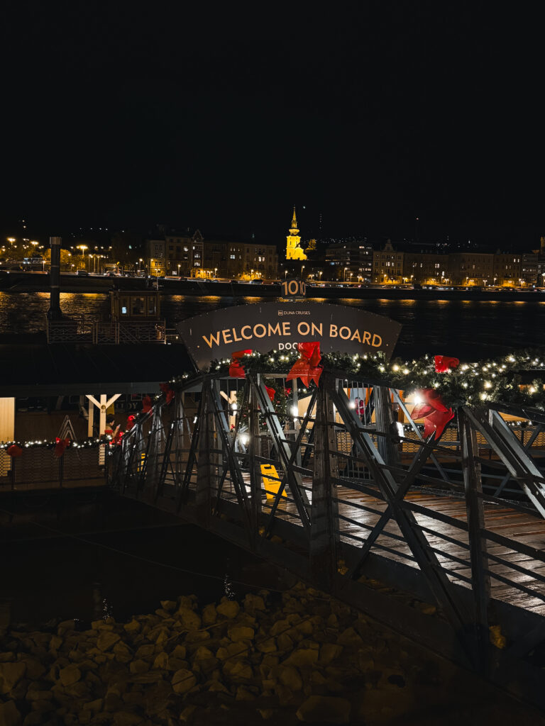 Duna Cruise dock in Budapest at Christmas decorated with Christmas lights and festive décor.