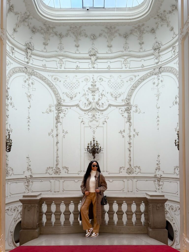 Zee's standing beneath the decorative glass ceiling at Ervin Szabó Library in Budapest