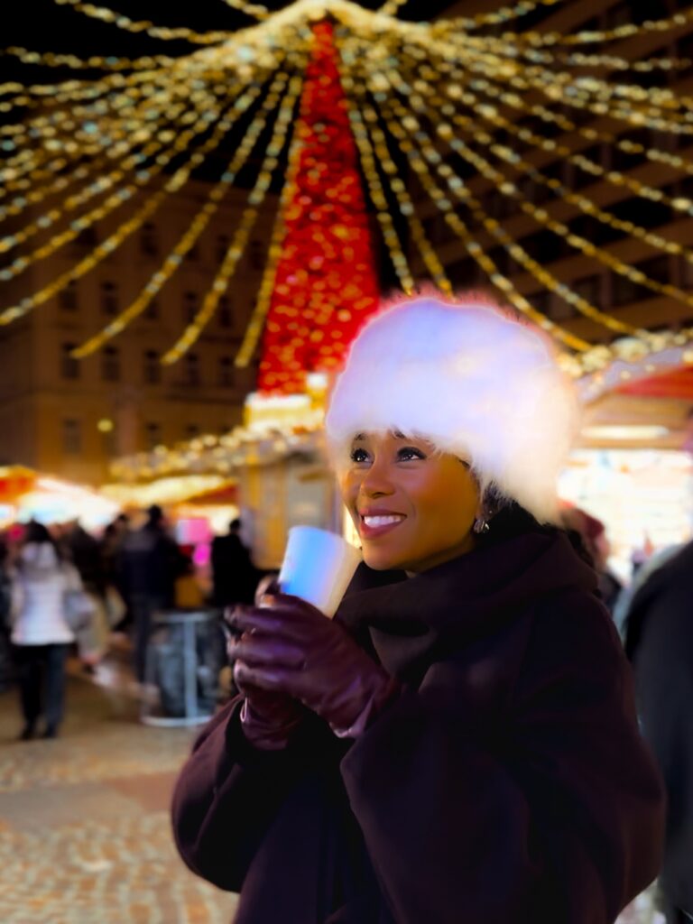 Zee James enjoying hot chocolate at the Basilica Christmas Market in Budapest.